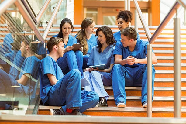 Students studying together on stairs