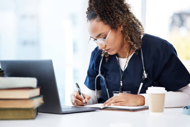 Student studying on a laptop